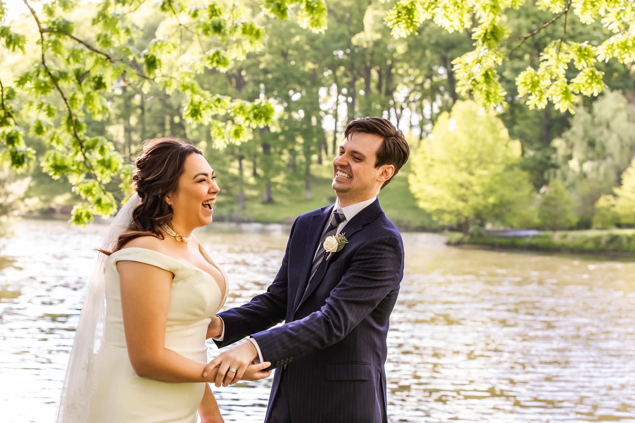 Bride and groom laughing at their backyard elopement in St. Louis